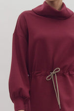 Solid Long Sleeve Tunic featuring Funnel Neck Adjustable Toggle Waist. Side slit at hem.