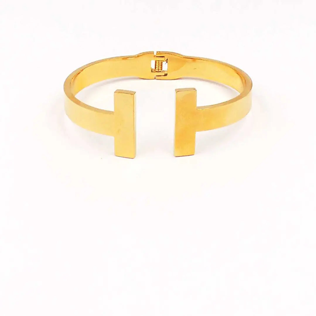 STAINLESS STEEL GOLD T HINGED BANGLE BRACELET