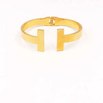 STAINLESS STEEL GOLD T HINGED BANGLE BRACELET