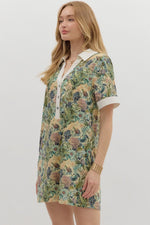 Floral print short sleeve mini dress featuring contrast accent collar button closure and band detail. Pockets at