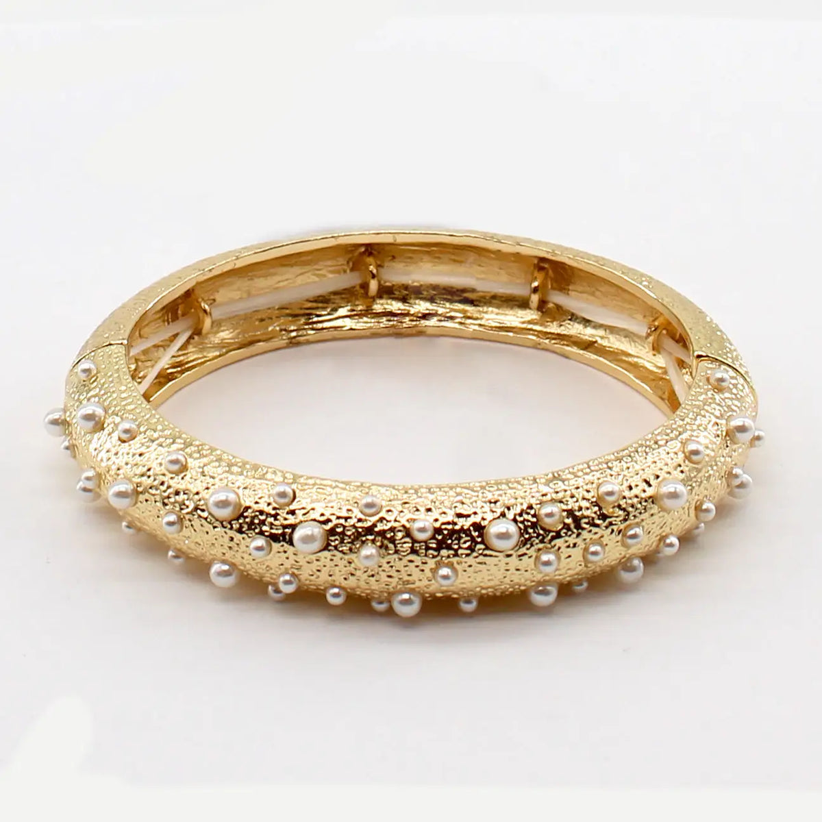 TEXTURED GOLD STRETCH BRACELET WITH SMALL PEARL ACCENT