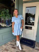 Sky Blue Button up dress with short sleeves, and ruffled yoke line detail.