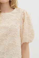 Solid Applique-Textured Bubble Sleeve Featuring Contrast Accent Bow Tie Closure at Back.