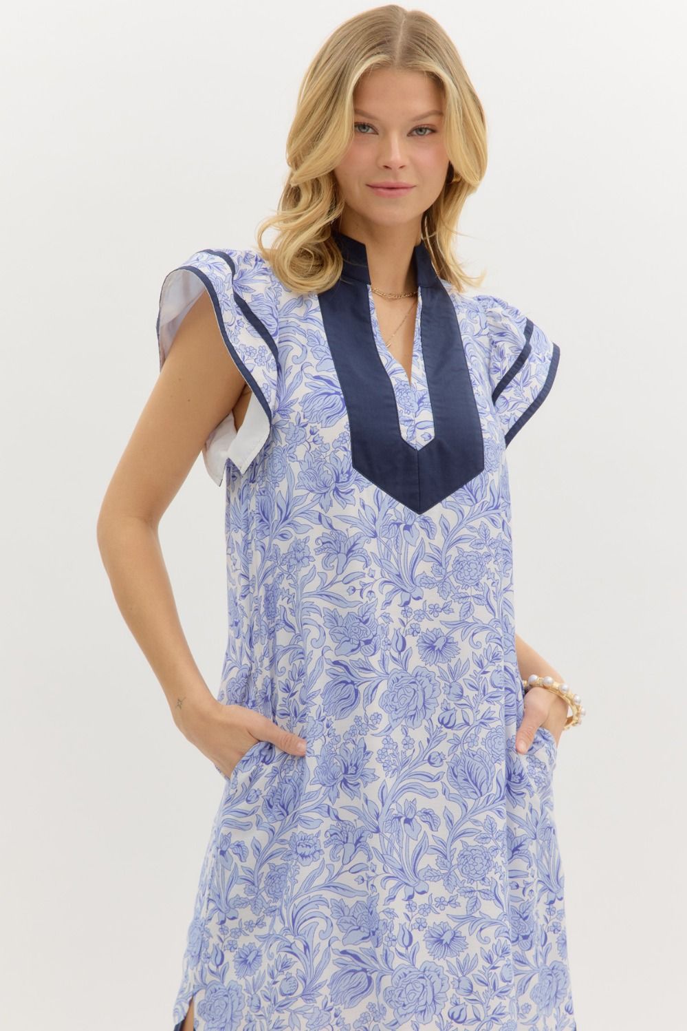 Set Sail Floral print flutter sleeve pullover midi dress featuring contrast accented caftan-inspired high neck band collar.