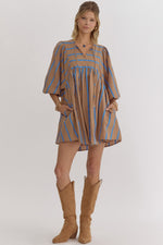 Stripe print babydoll 3/4 sleeve mini dress featuring self tie at front. Elastic at cuff. Pocket at sides.