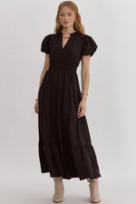 Solid v-neck bubble sleeve tiered midi dress featuring elastic waistband. Ruffle neckline detail.