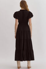 Solid v-neck bubble sleeve tiered midi dress featuring elastic waistband. Ruffle neckline detail.