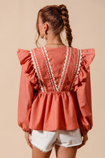 Coral WOVEN LONG SLEEVE TOP WITH WAVE TRIM