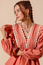 Coral WOVEN LONG SLEEVE TOP WITH WAVE TRIM