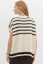 Striped off shoulder oversized sweater knit pullover top featuring mock neck.