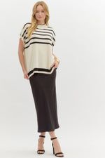 Striped off shoulder oversized sweater knit pullover top featuring mock neck.