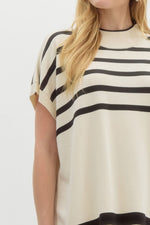 Striped off shoulder oversized sweater knit pullover top featuring mock neck.