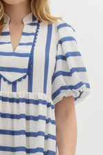 Navy Striped short bubble sleeve pullover dress featuring scallop accent front. Pockets at side. Lined