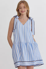 Stripe Print V-neck Sleeveless Mini Dress featuring self tie at shoulders. Pocket at sides. Lined.