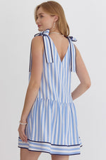 Stripe Print V-neck Sleeveless Mini Dress featuring self tie at shoulders. Pocket at sides. Lined.